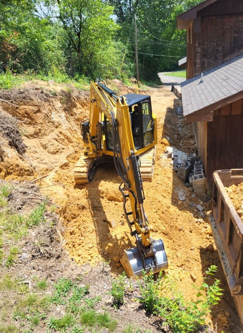 Excavated trenches for concrete footings prepared for a new residential structure."